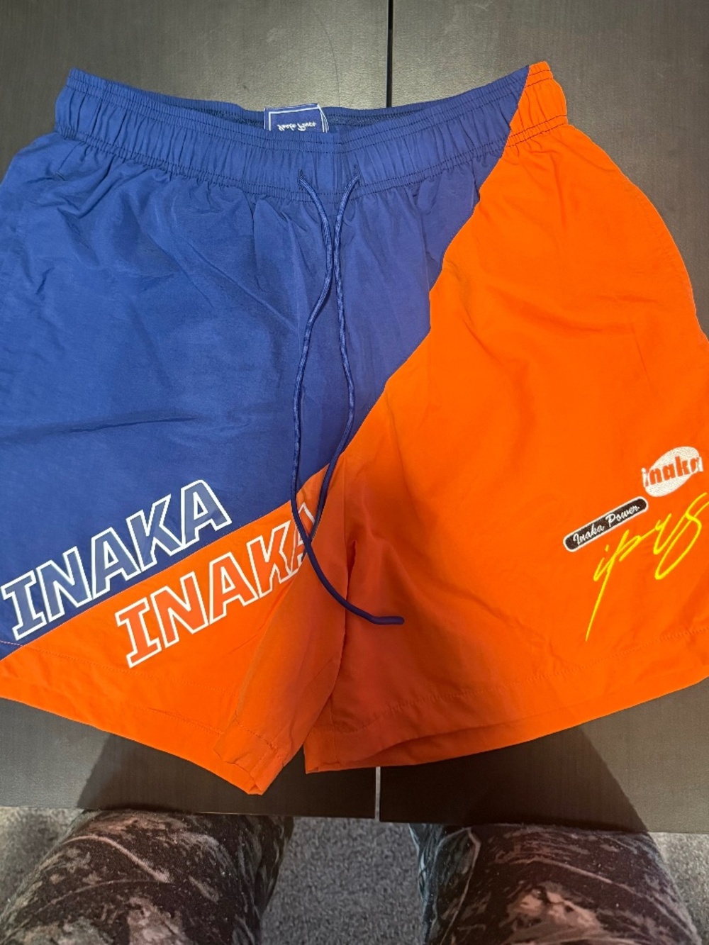 Men's Orange and Blue Inaka Power Mens Shorts. Size: Small.